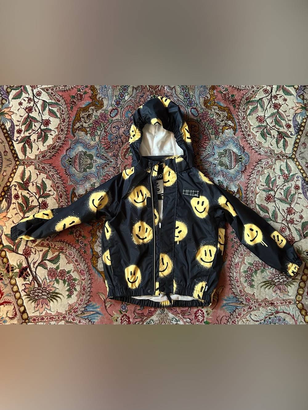 Molo Waiton Rainjacket in Happy! Size 110/116, or size 5-6